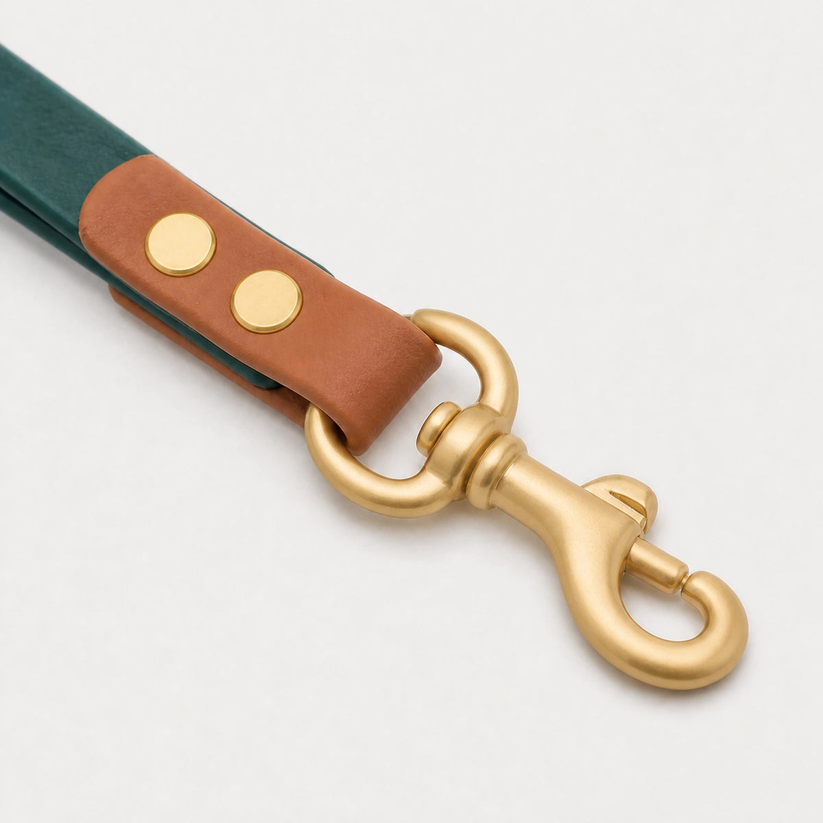 Moss Reserve waste bag holder hardware detail in moss green, caramel brown, and matte gold