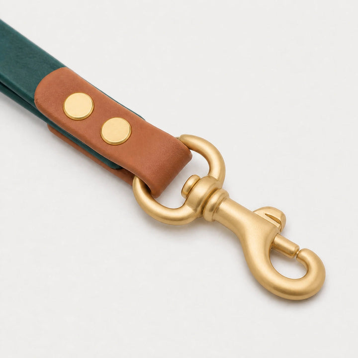 Moss Reserve waste bag holder hardware detail in moss green, caramel brown, and matte gold