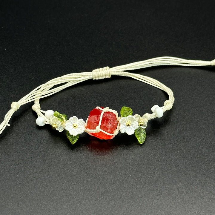 Scarlet Bloom bracelet with vivid red and mixed-color crystal blossoms on a braided cord