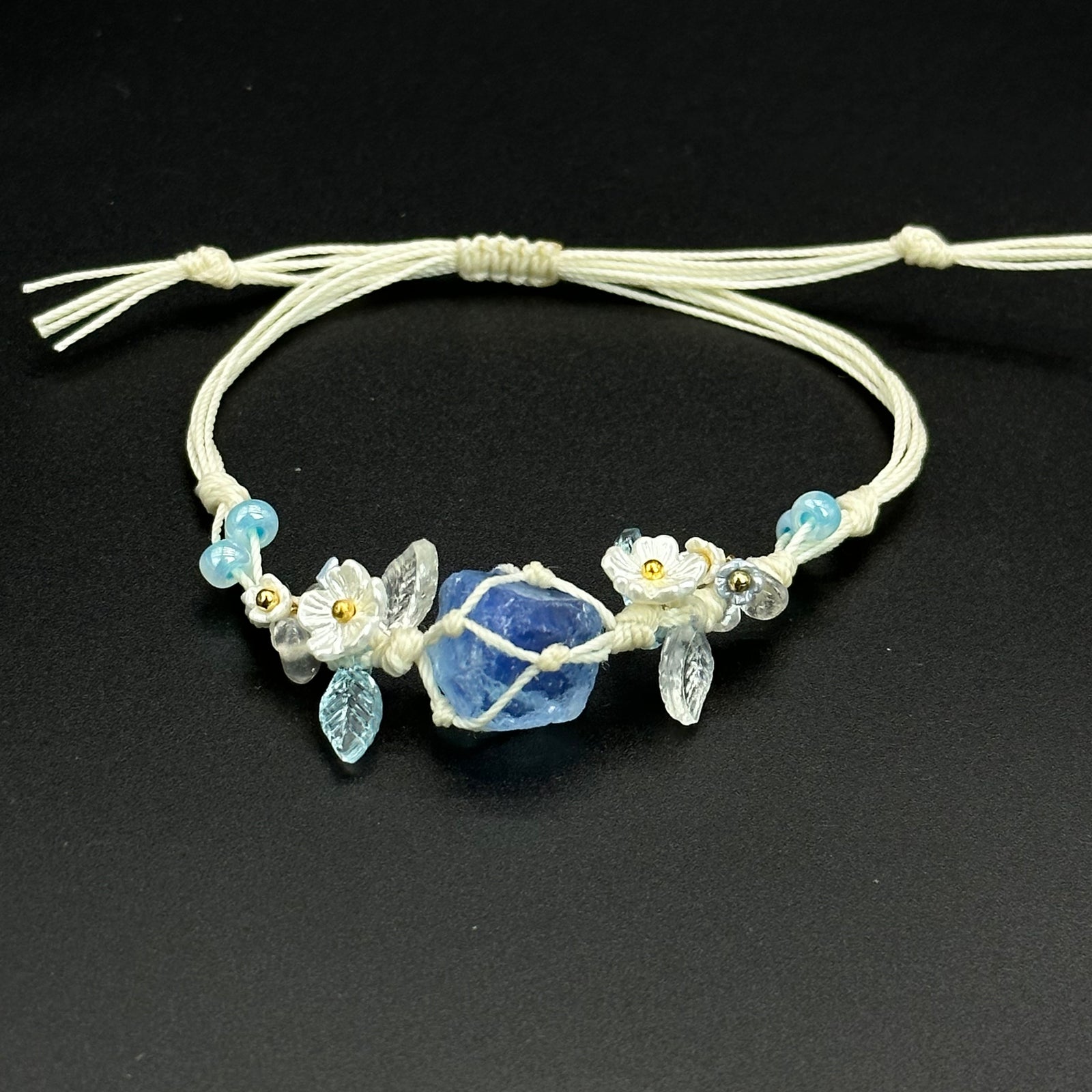 Bluebell Garden bracelet with cool blue, clear, and pale crystal accents on a braided cord